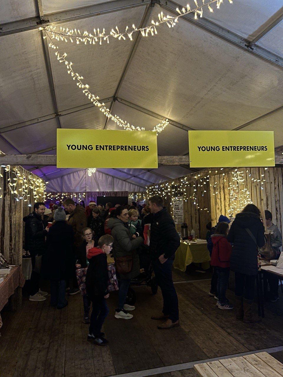 Crowds in the Young Entrepreneurs tent under fairy lights